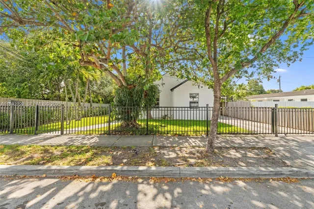 a view of a yard with a trampoline