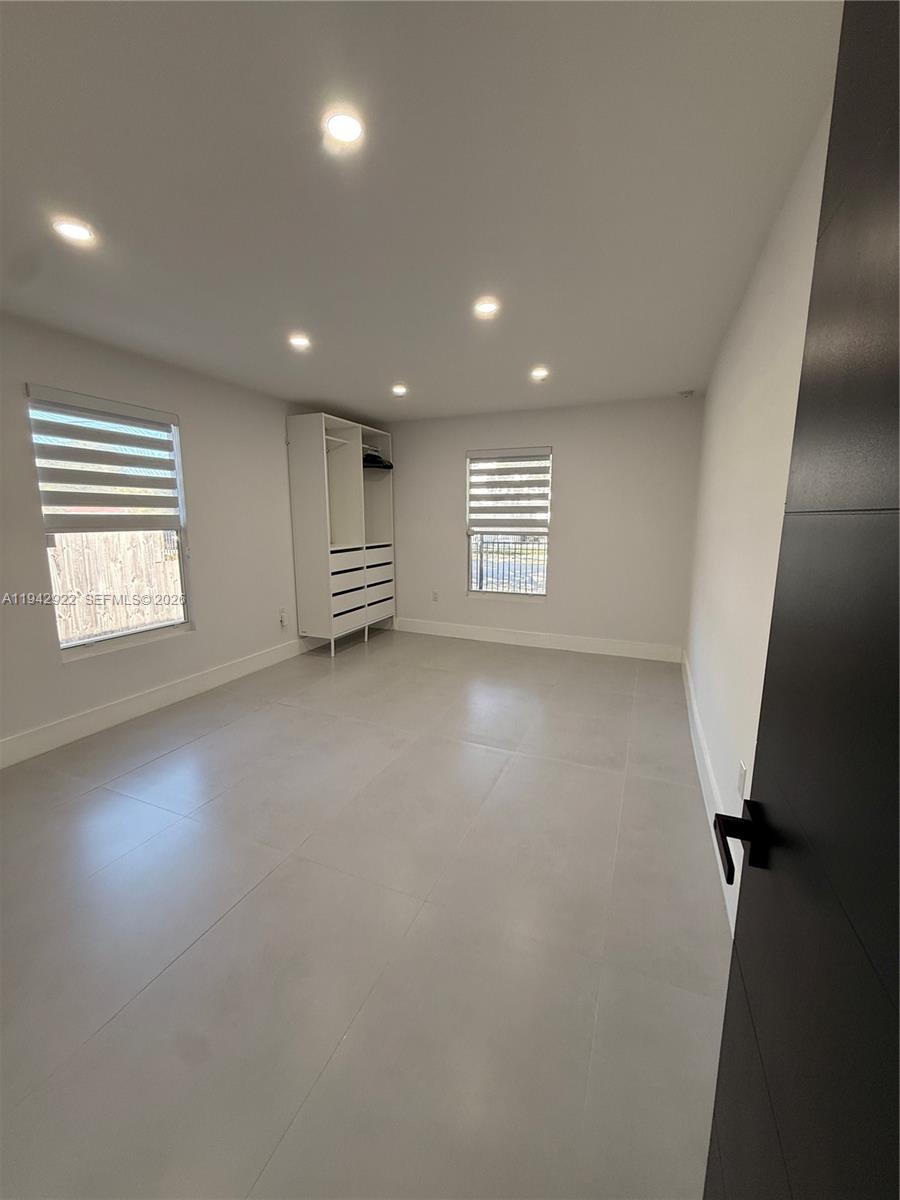 4430 Northwest 1st Avenue Miami, FL 33127 - Photo 24 of 31 wooden floor in an empty room with a window