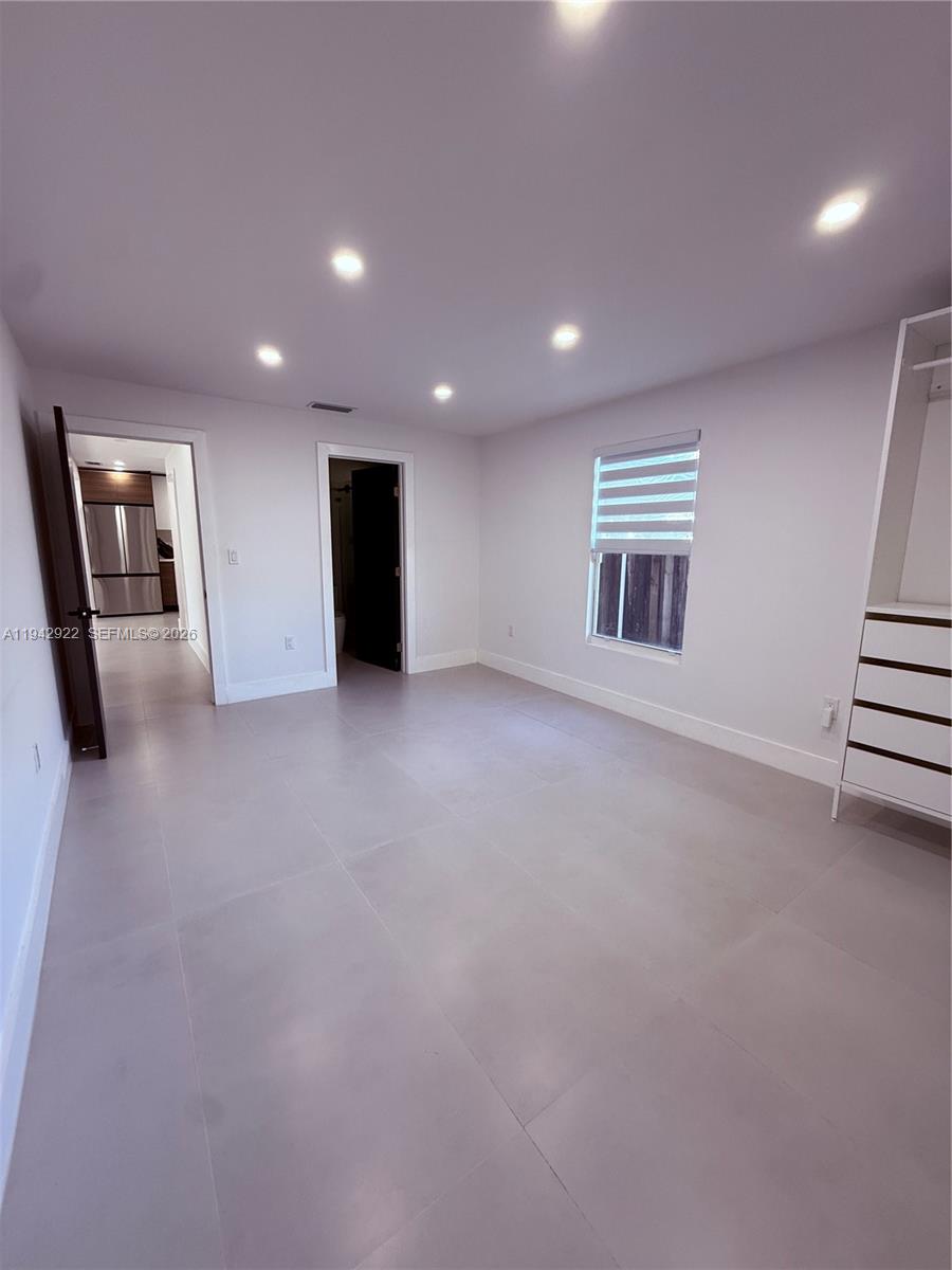 4430 Northwest 1st Avenue Miami, FL 33127 - Photo 25 of 31 an empty room with windows and pillars in it