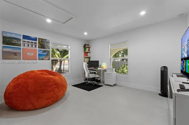 a room with furniture and gym equipment