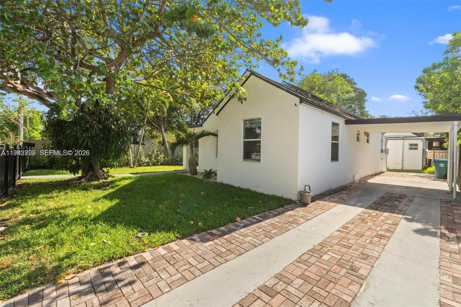 4430 Northwest 1st Avenue Miami, FL 33127 - Photo 4 of 31 a front view of a house with garden