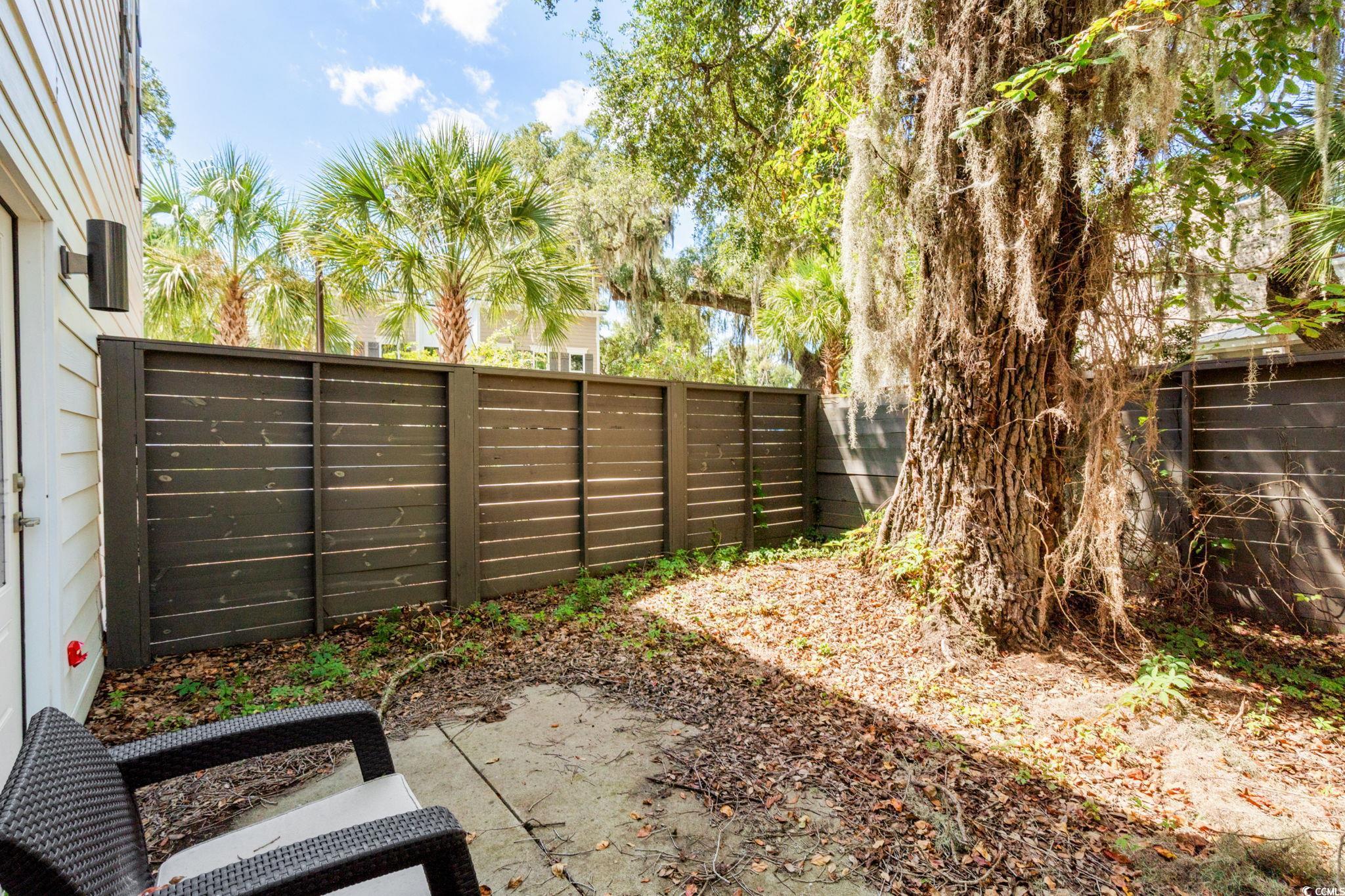 34 Shady Moss Loop, Unit 34 Murrells Inlet, SC 29576 - Photo 28 of 40 Fenced backyard featuring a patio area