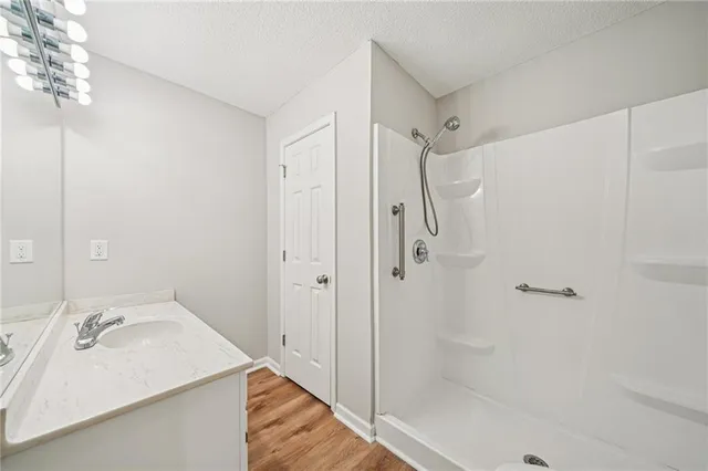 a bathroom with a sink and shower