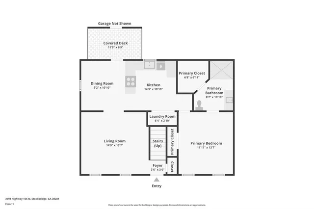 a view of a white house with a large windows and a large tree