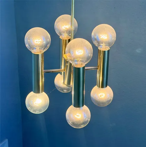 a view of a dining room with table and chandelier