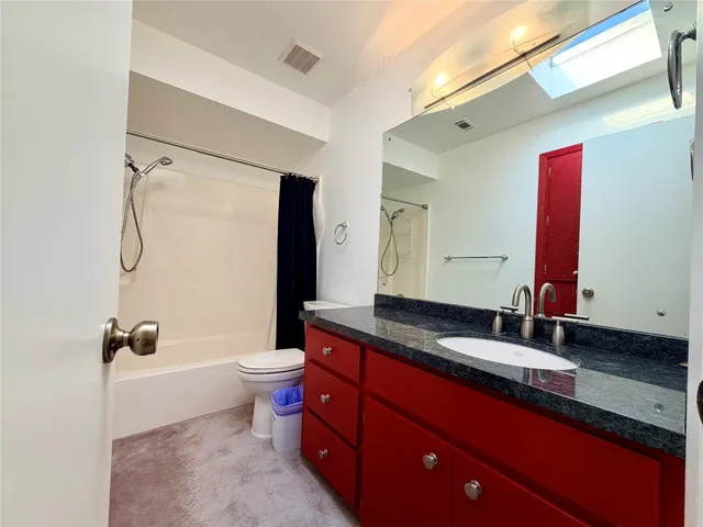 a bedroom with bed and window