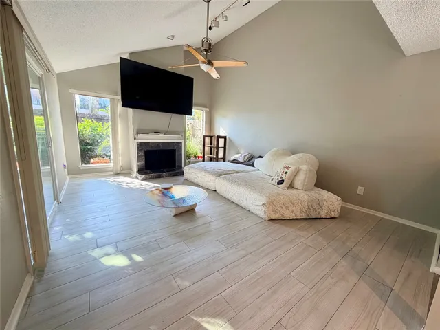 a bedroom with a bed and a fireplace