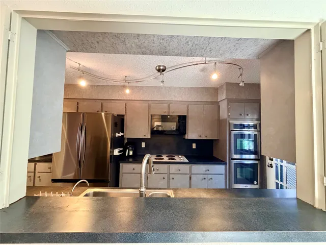 a view of a living room a kitchen