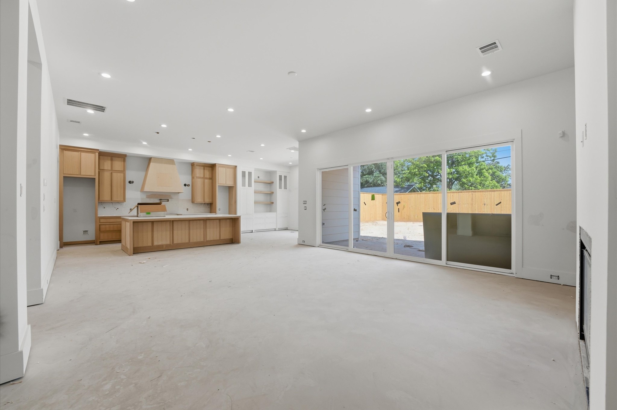 609 East 25th Street Houston, TX 77008 - Photo 3 of 42 Chef-inspired kitchen boasts custom cabinetry and quartz countertops with a conveniently located adjacent dining area.