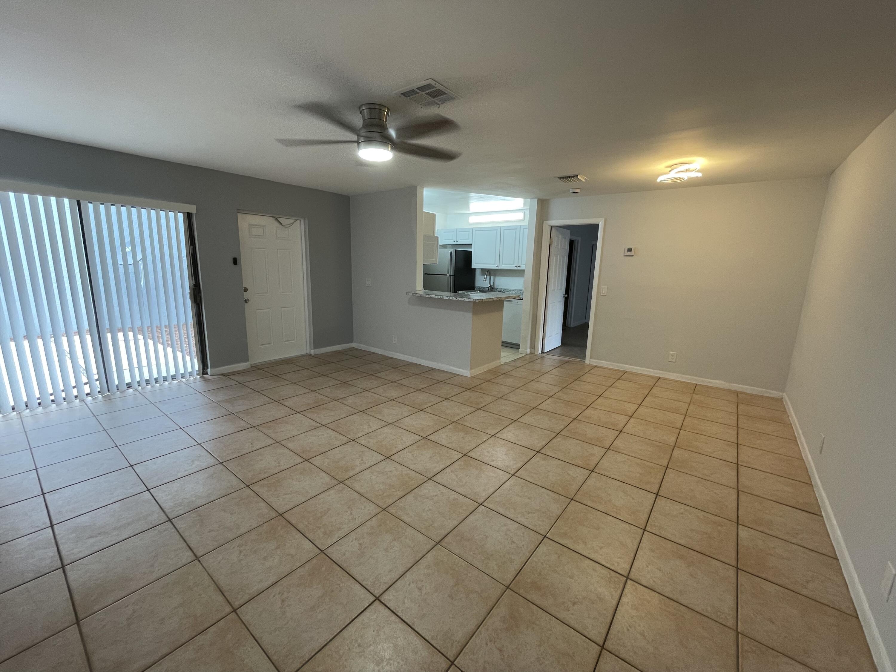 28 Crossings Circle, Unit B Boynton Beach, FL 33435 - Photo 3 of 19 a view of a hallway and window
