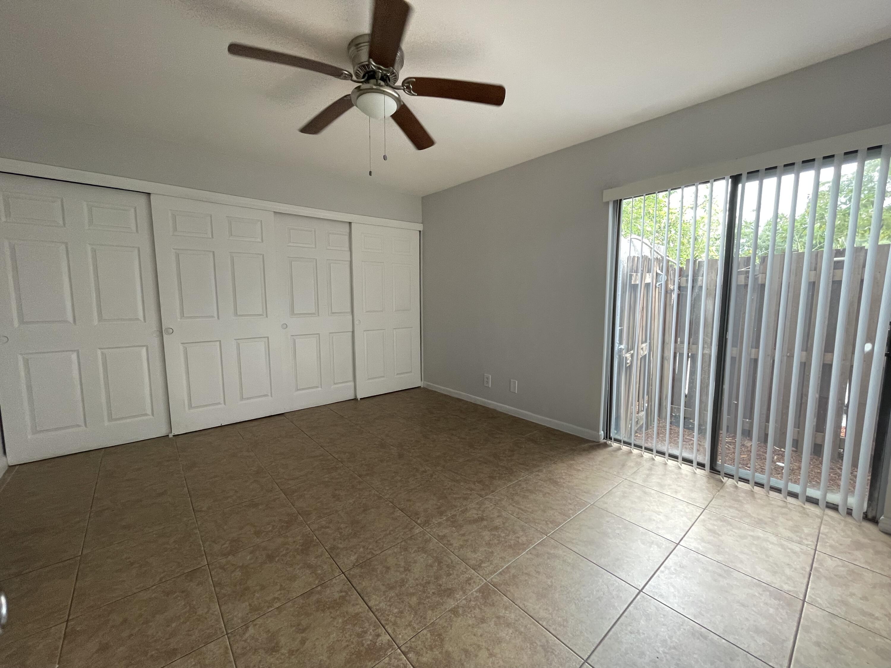 28 Crossings Circle, Unit B Boynton Beach, FL 33435 - Photo 6 of 19 a view of an empty room with a window
