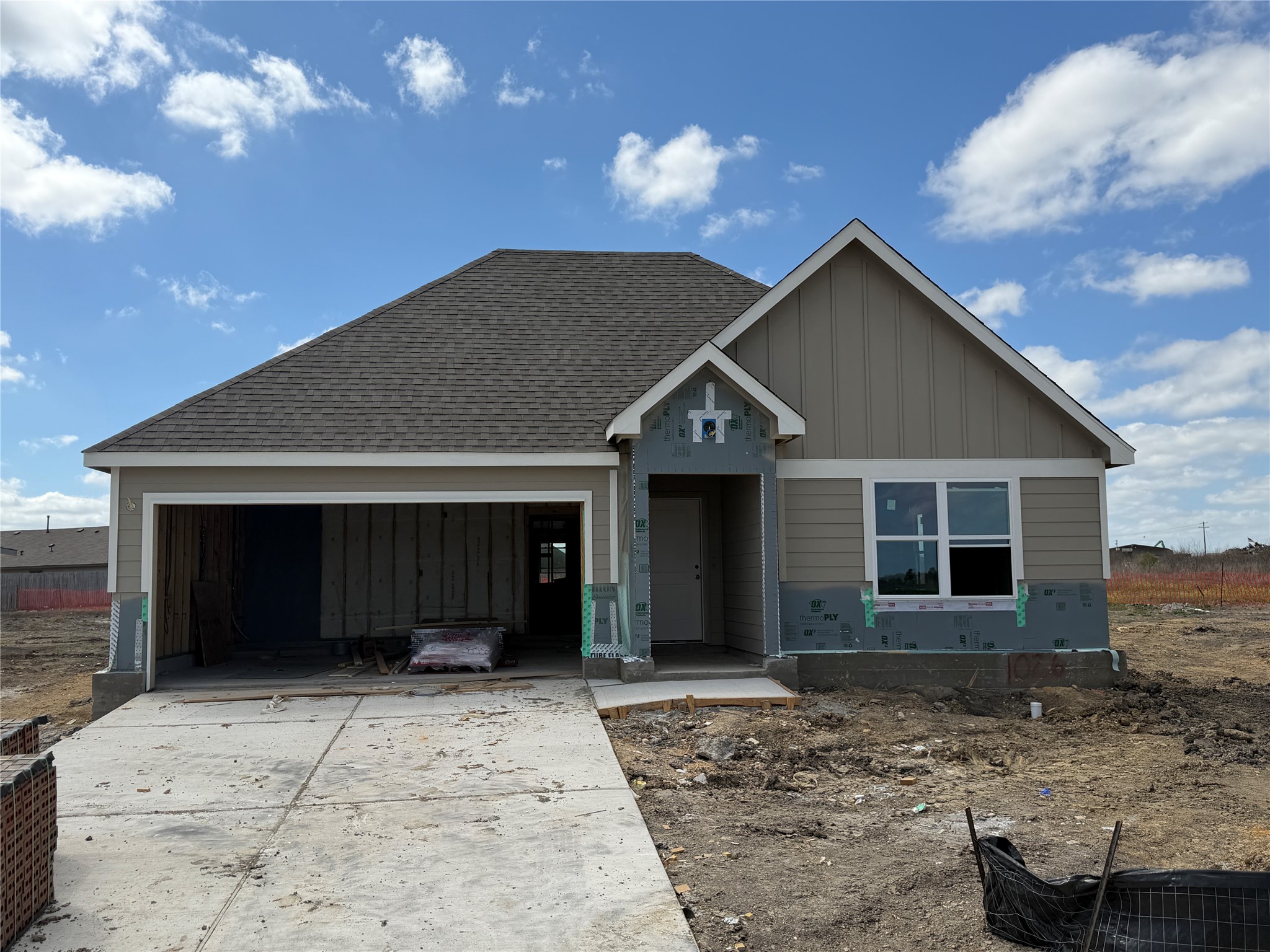 1026 Legrand Street Brenham, TX 77833 - Photo 1 of 16 a front view of a house with a yard and garage