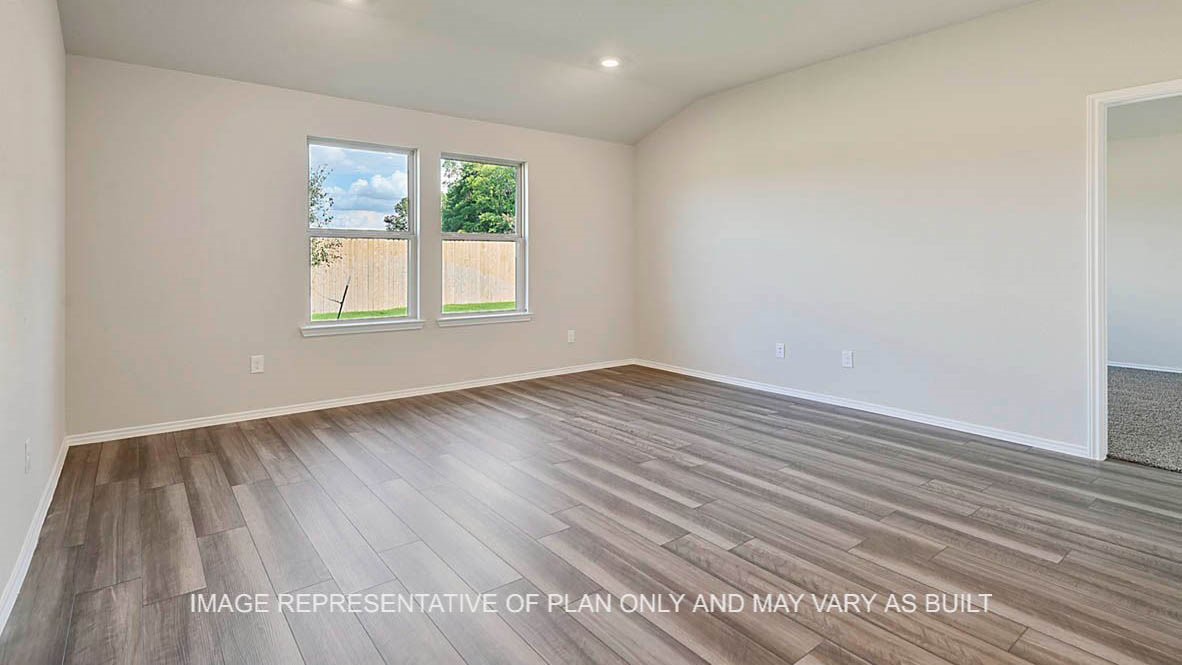 1026 Legrand Street Brenham, TX 77833 - Photo 13 of 16 wooden floor in an empty room with a window
