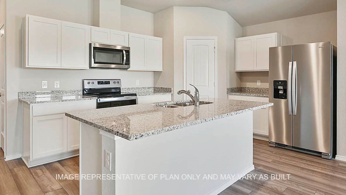 1026 Legrand Street Brenham, TX 77833 - Photo 16 of 16 a kitchen with stainless steel appliances granite countertop a sink stove refrigerator and cabinets