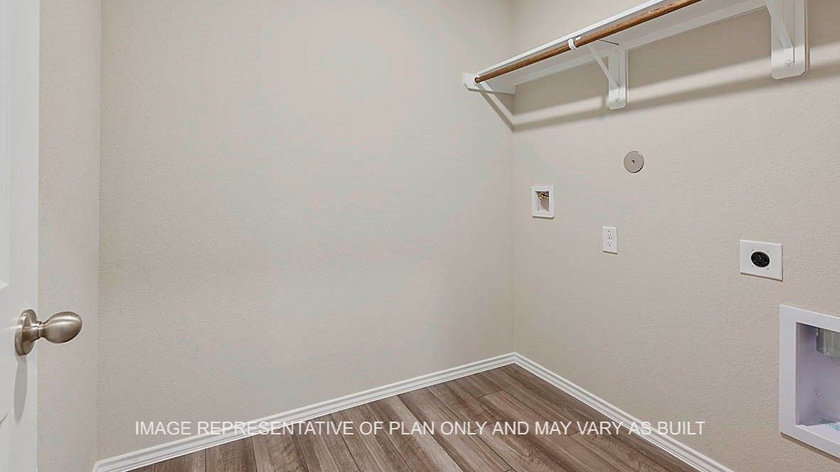 1026 Legrand Street Brenham, TX 77833 - Photo 2 of 16 a view of a room with racks on the wall