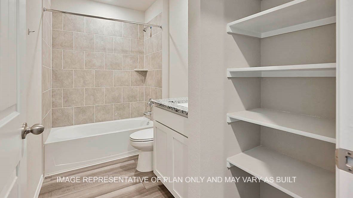 1026 Legrand Street Brenham, TX 77833 - Photo 4 of 16 a bathroom with a toilet and a shower