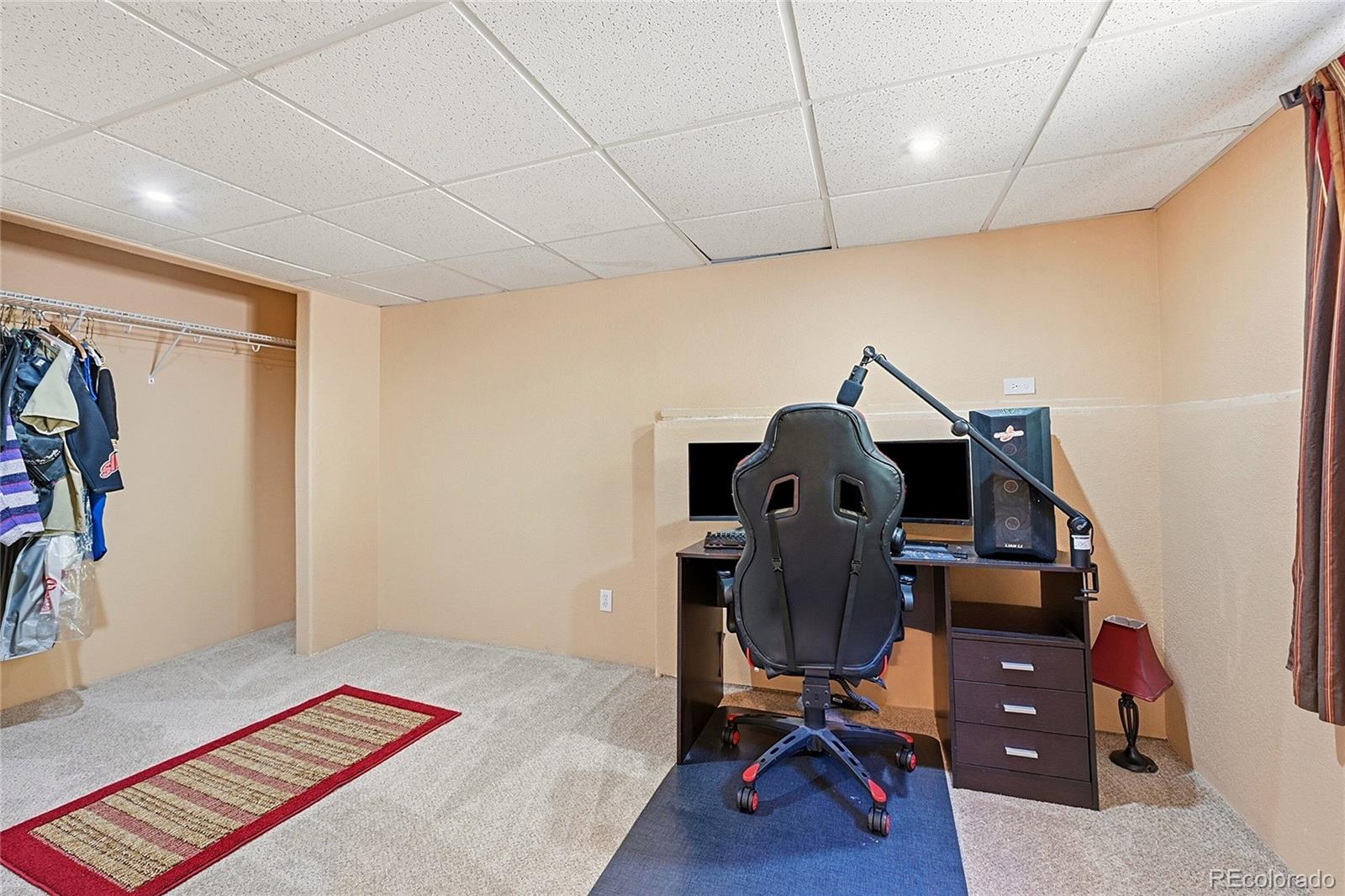 427 Brookside Drive Bailey, CO 80421 - Photo 30 of 37 a room with furniture and wooden floor