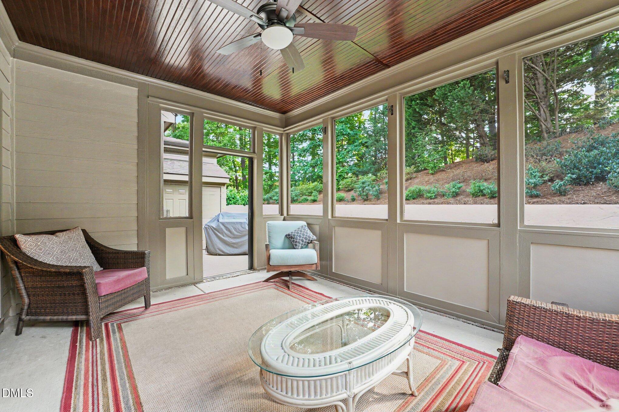 1729 Frenchwood Drive Raleigh, NC 27612 - Photo 36 of 46 a living room with a couch and a table