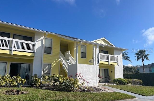 455 Alt 19, Unit 65 Palm Harbor, FL 34683 - Photo 1 of 11 a front view of a house with a yard