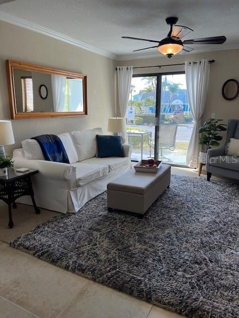 455 Alt 19, Unit 65 Palm Harbor, FL 34683 - Photo 2 of 11 a living room with furniture and a large window