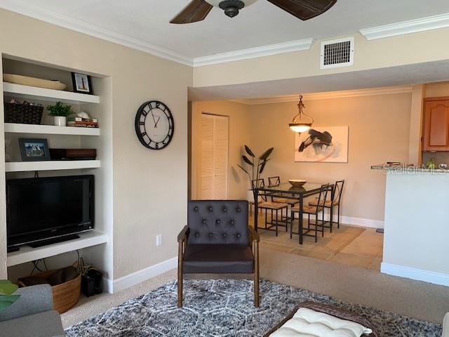 455 Alt 19, Unit 65 Palm Harbor, FL 34683 - Photo 3 of 11 a view of a livingroom with furniture and flat screen tv