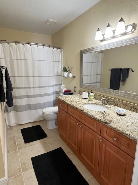 455 Alt 19, Unit 65 Palm Harbor, FL 34683 - Photo 8 of 11 a bathroom with a sink and a mirror