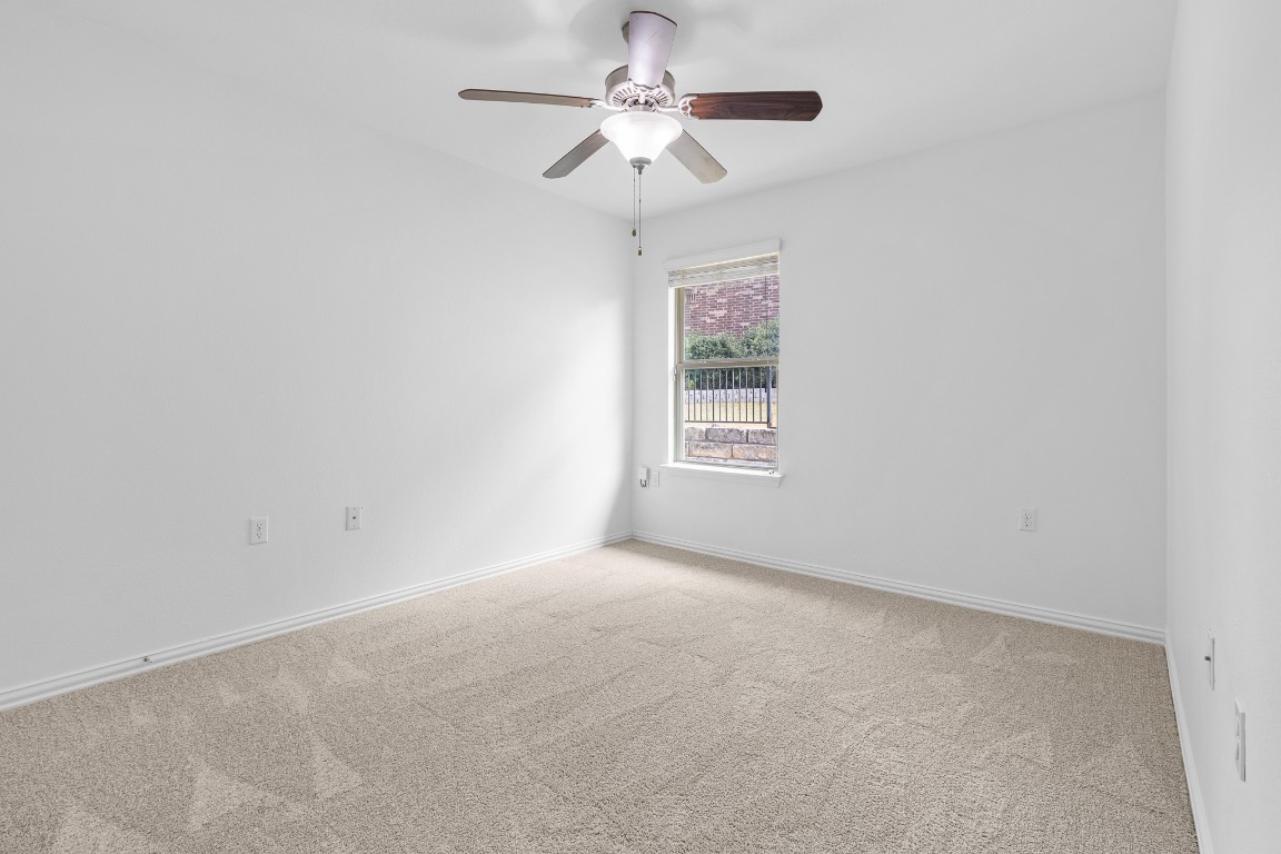 5621 Little Theater Bend Austin, TX 78747 - Photo 15 of 38 a view of an empty room with a window