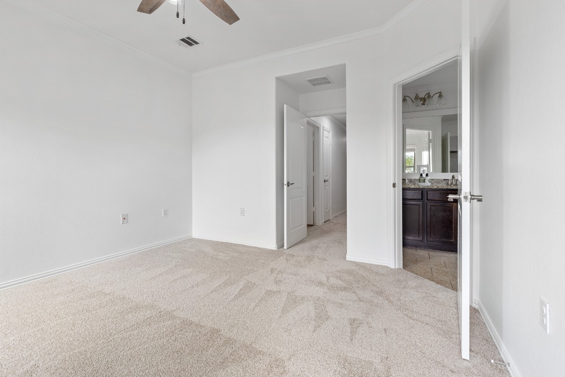 5621 Little Theater Bend Austin, TX 78747 - Photo 26 of 38 an empty room with kitchen and a window