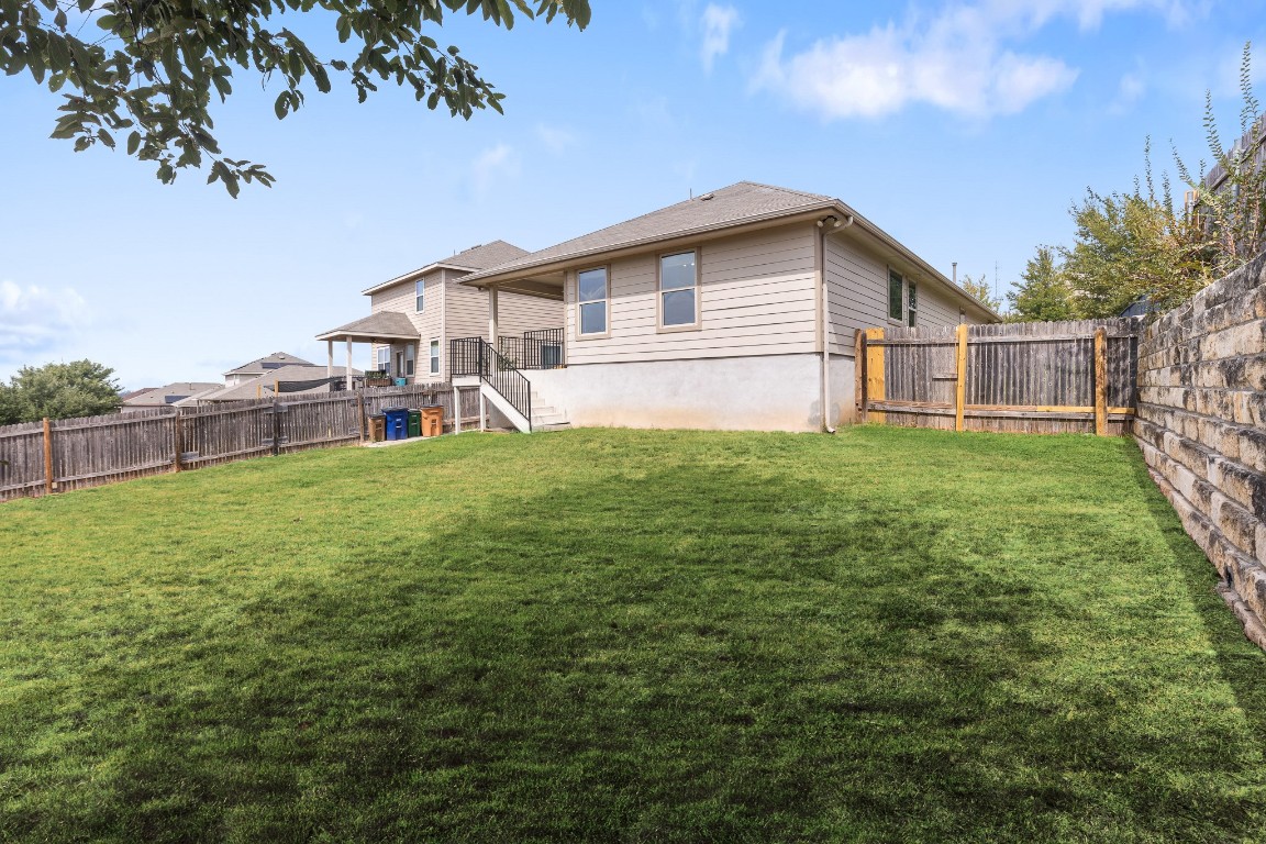 5621 Little Theater Bend Austin, TX 78747 - Photo 33 of 38 a view of a house with a yard and sitting area