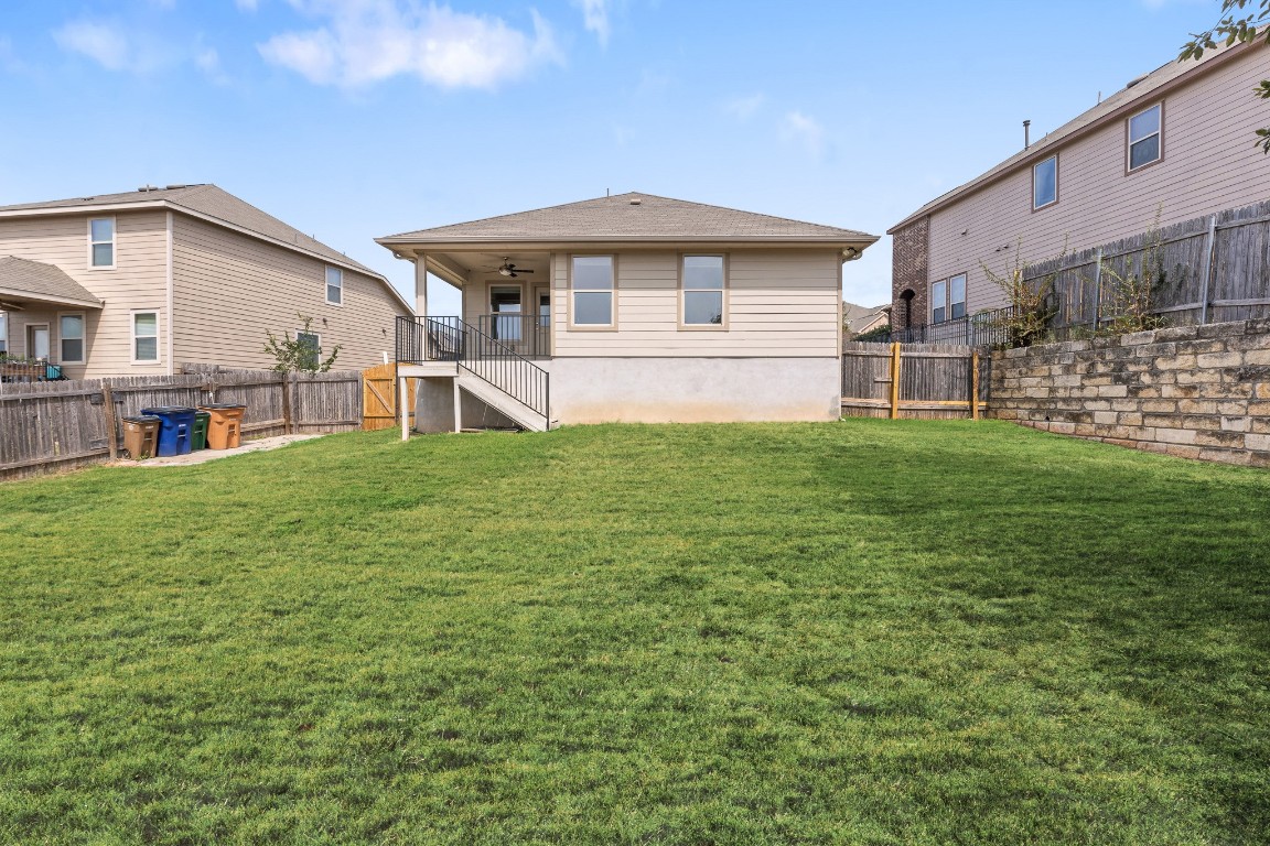 5621 Little Theater Bend Austin, TX 78747 - Photo 34 of 38 a view of a house with a yard