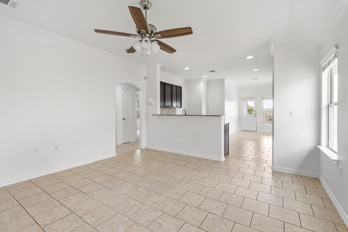 5621 Little Theater Bend Austin, TX 78747 - Photo 4 of 38 a view of a kitchen with a sink and a refrigerator
