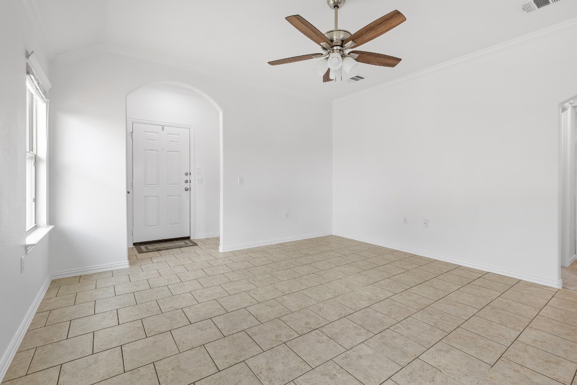 5621 Little Theater Bend Austin, TX 78747 - Photo 5 of 38 an empty room with closet and fan