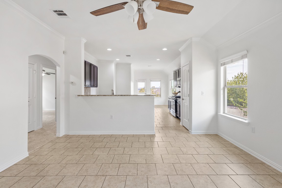 5621 Little Theater Bend Austin, TX 78747 - Photo 7 of 38 a view of a kitchen with an empty space and a window