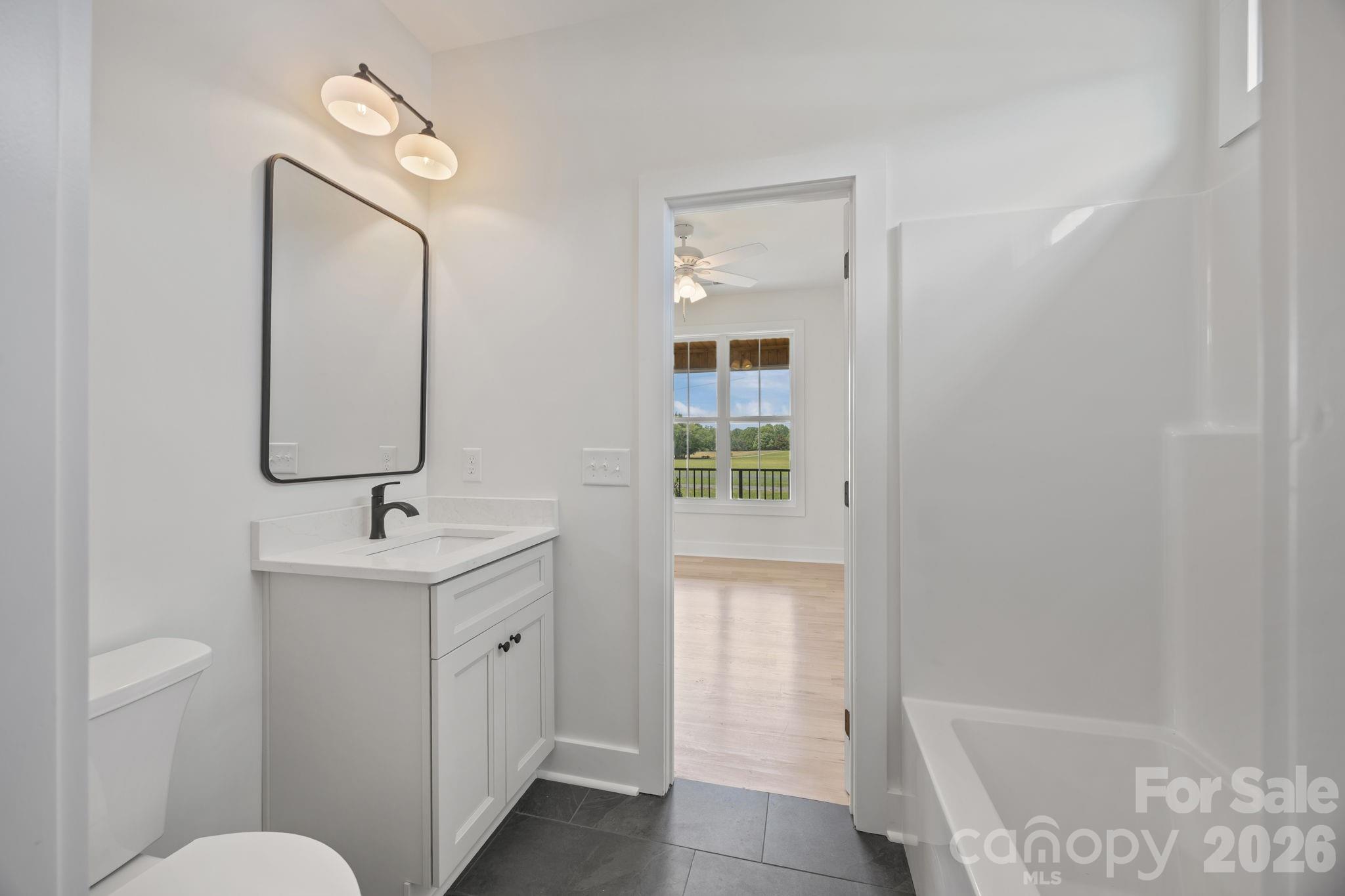 4805 Patterson Road China Grove, NC 28023 - Photo 32 of 42 a bathroom with a sink a toilet and shower