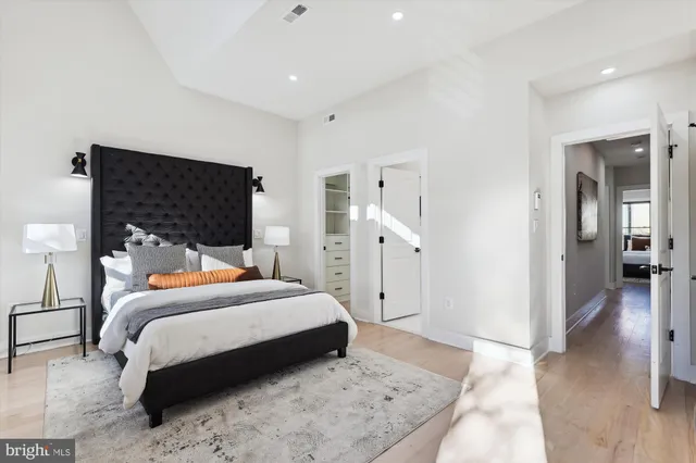 a bedroom with a bed and a view of bathroom