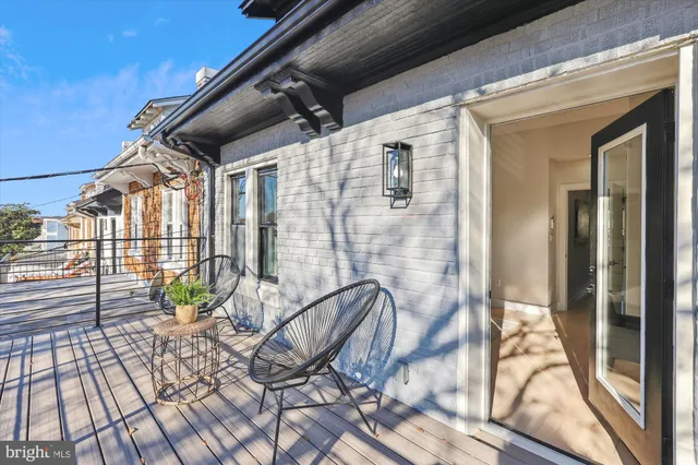 a view of balcony with wooden floor