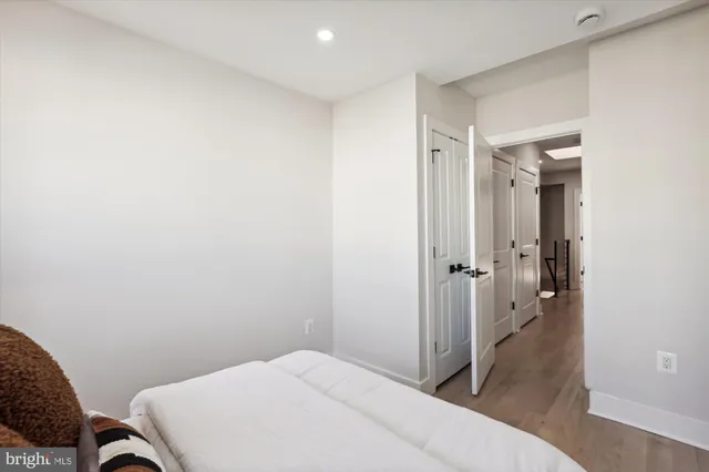 a bedroom with a bed and a furniture