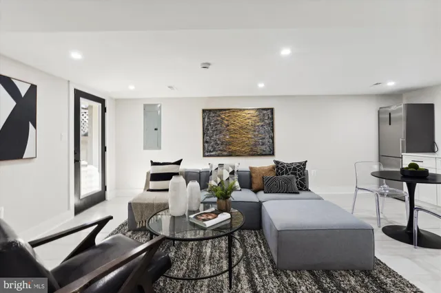 a living room with furniture and a table