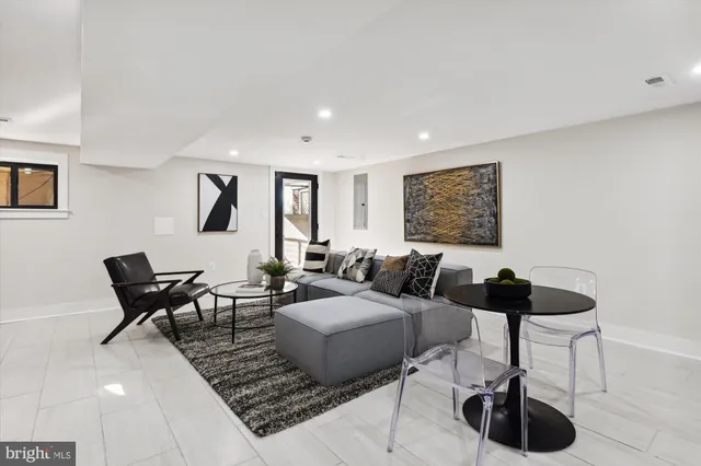 a living room with furniture and a rug