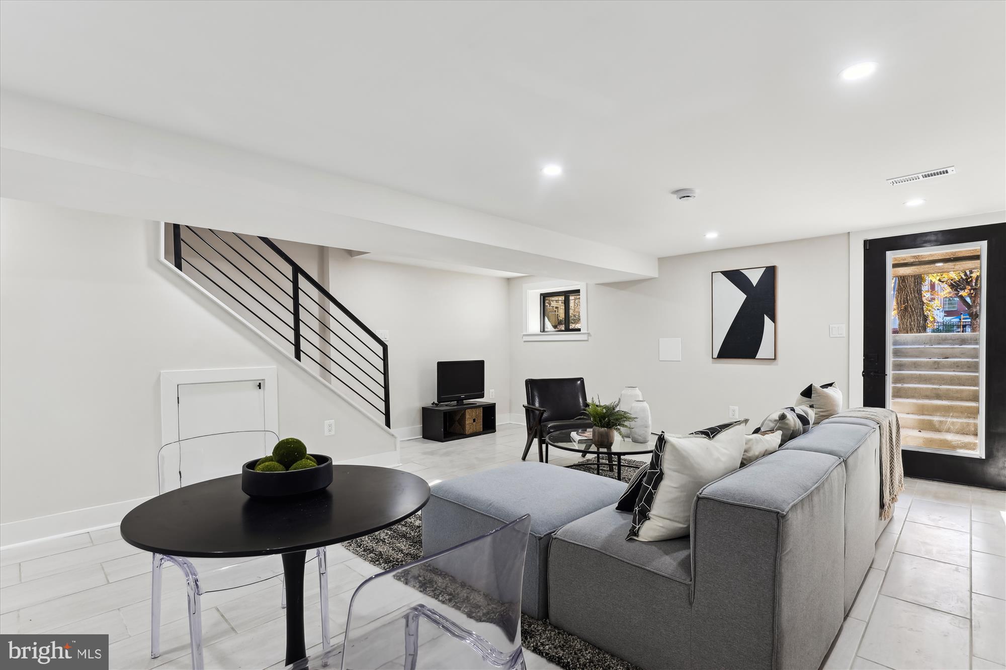 411 Decatur Street Northwest Washington, DC 20011 - Photo 41 of 52 a living room with furniture and a view of kitchen