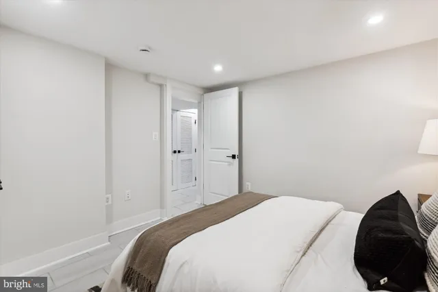 a bedroom with a bed and a closet