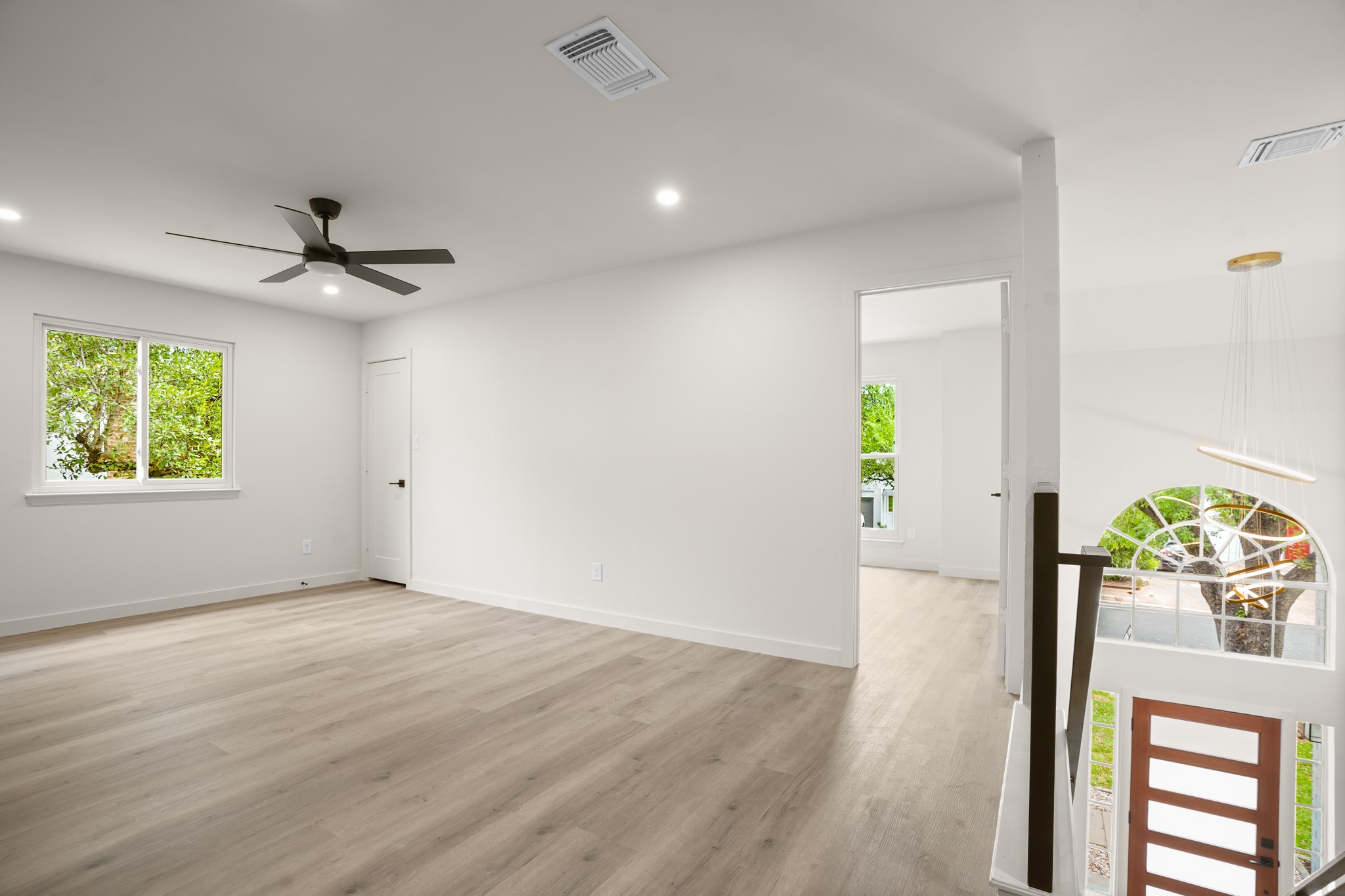 7826 Wheel Rim Circle Austin, TX 78749 - Photo 18 of 38 Smooth wood floors and crisp white walls create a clean, contemporary upper-level landing.