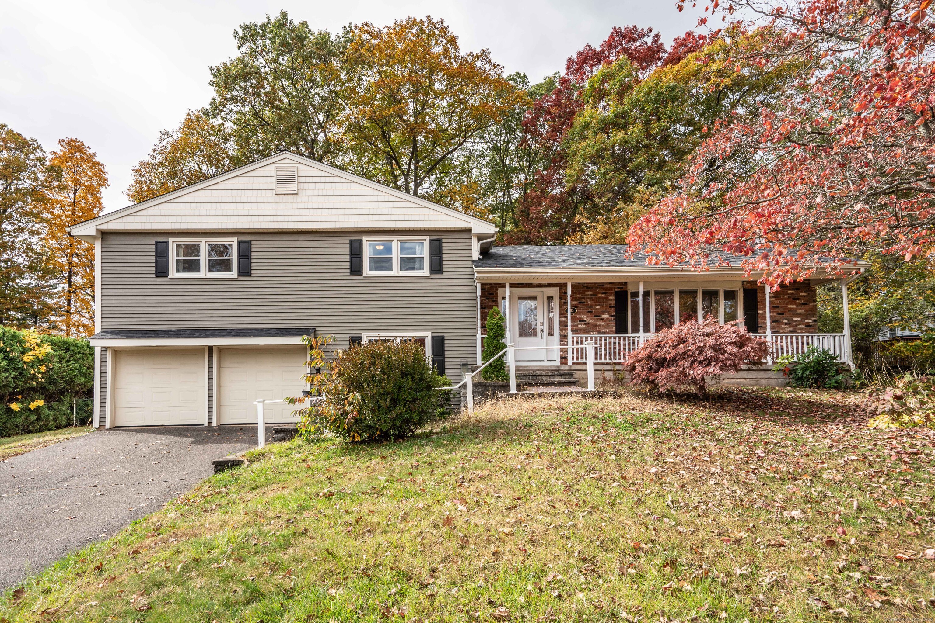 a front view of a house with a yard