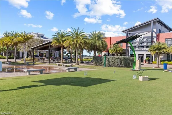 a view of swimming pool with a garden and seating area