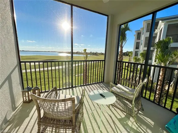 a view of a balcony with wooden floor