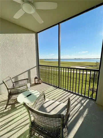 a view of balcony with wooden floor