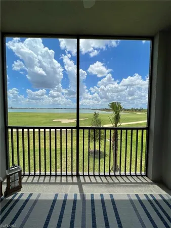 a large kitchen with kitchen island a dining table and chairs