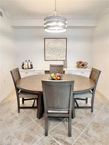 a bedroom with a bed and a flat tv screen on the dresser