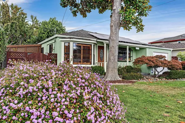 front view of a house with a garden