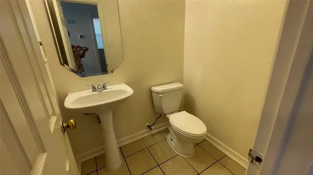 a view of staircase with white walls and a window